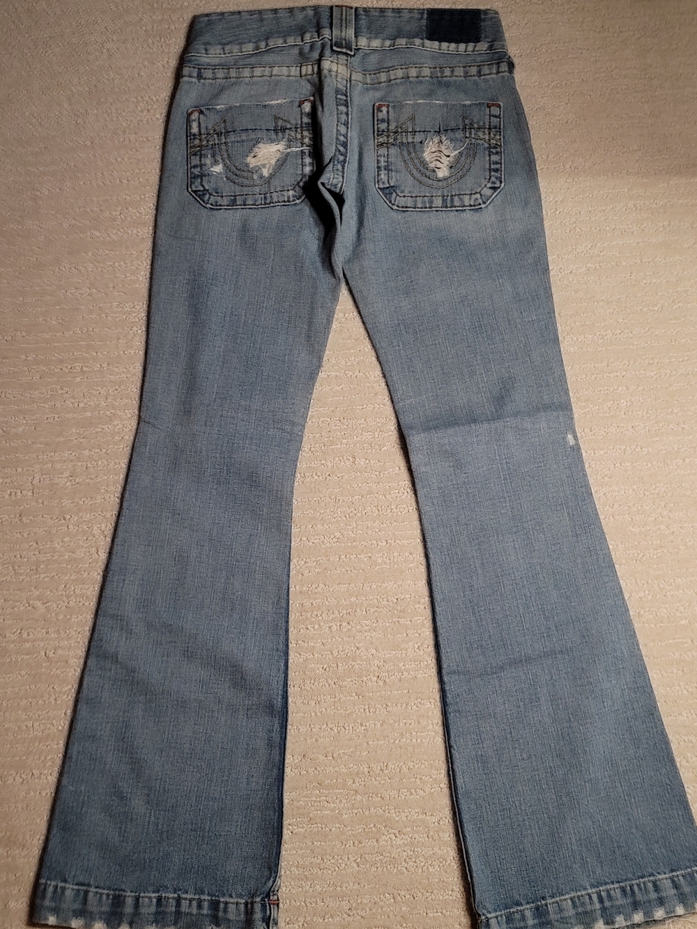 True Religion Light Blue Flare Jeans with Distressed Back Pockets